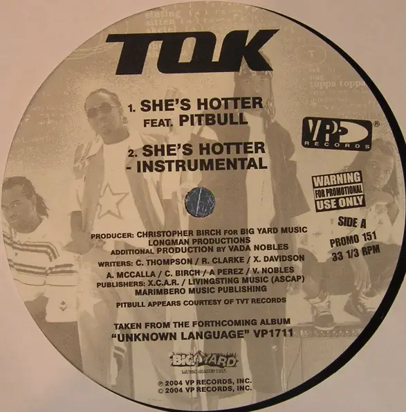 T.O.K. - She's Hotter / She's Hot - Disque Maxi 45T