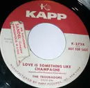 7inch Vinyl Single - The Troubadors - Love Is Something Like Champagne/Was It Day, Was It Night?