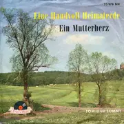 7inch Vinyl Single - Tom & Tommy - Eine Handvoll Heimaterde / Ein Mutterherz