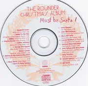 CD - Luther Johnson, Bill Keith, Mary McCaslin, a. o. - Must Be Santa! (The Rounder Christmas Album)