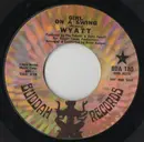 7inch Vinyl Single - Wyatt - Girl On A Swing / He Thinks He's A Hero