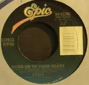 7'' - Exile - Hang On To Your Heart / She Likes Her Lovin'