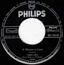 7inch Vinyl Single - Frankie Laine - A Woman In Love / Walking The Night Away - Mono