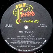 M.C. Holiday