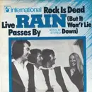 7inch Vinyl Single - Rain - Rock Is Dead (But It Won't Lie Down) / Live Passes By